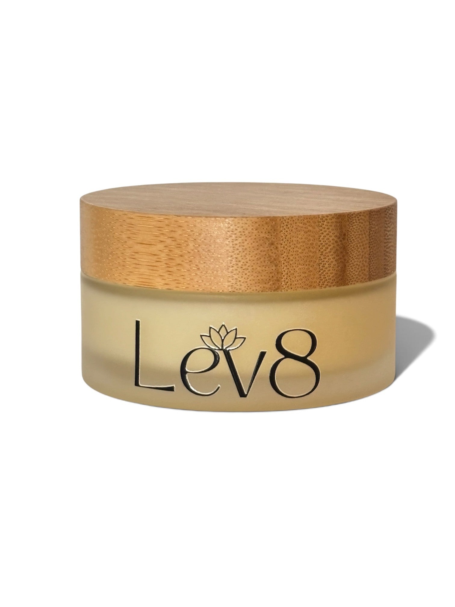 A round cosmetic jar with a light wood-grain lid and a frosted beige body, featuring the brand name 'Lev8' printed in black on the front, set against a plain white background.